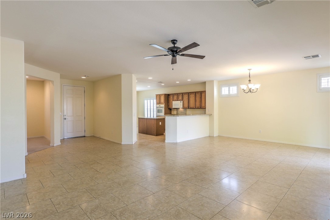2276 Saxtons River Road Henderson, NV 89044 - Photo 4 of 49 Spacious Great Room with Ceiling Fan and Tile Flooring