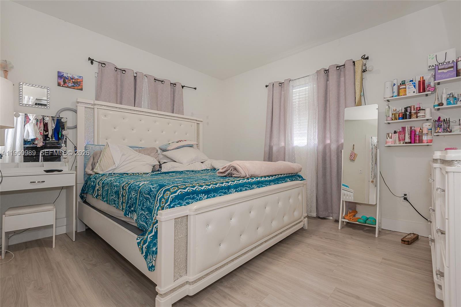 110 Northwest 58th Street Miami, FL 33127 - Photo 13 of 27 a bedroom with a bed and a walk in closet