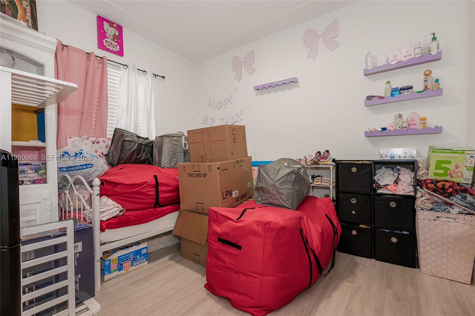 110 Northwest 58th Street Miami, FL 33127 - Photo 16 of 27 a bedroom with bed and a window