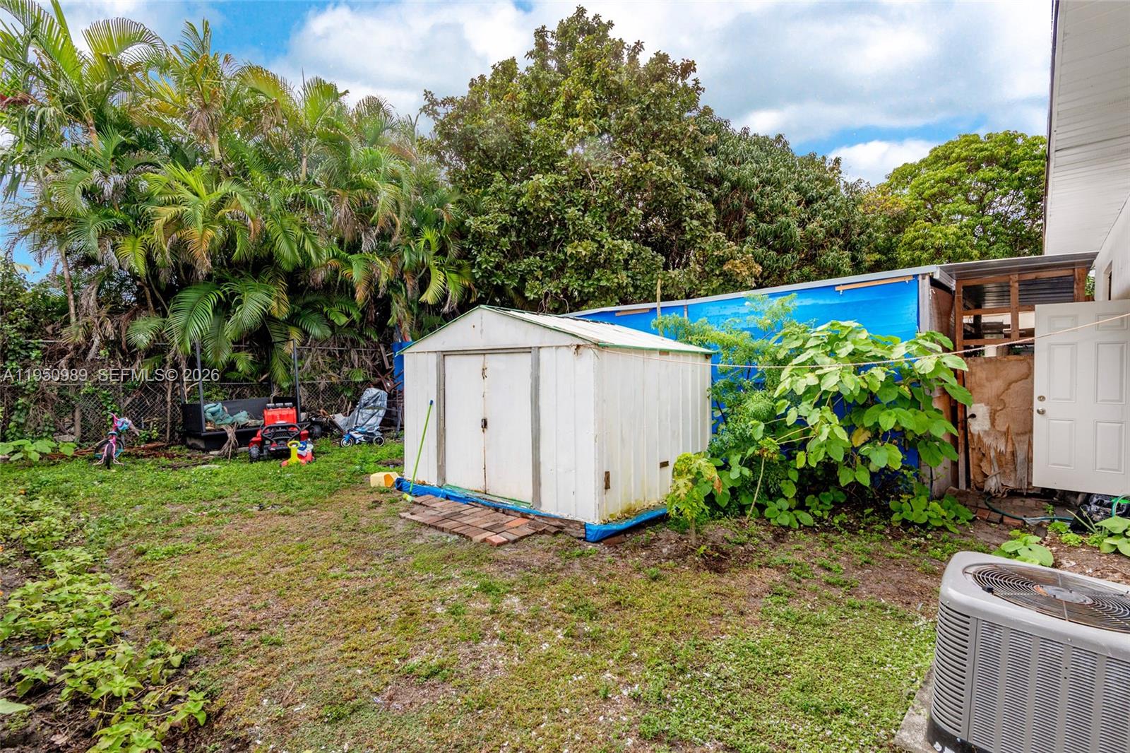 110 Northwest 58th Street Miami, FL 33127 - Photo 25 of 27 a view of backyard with barn and plants