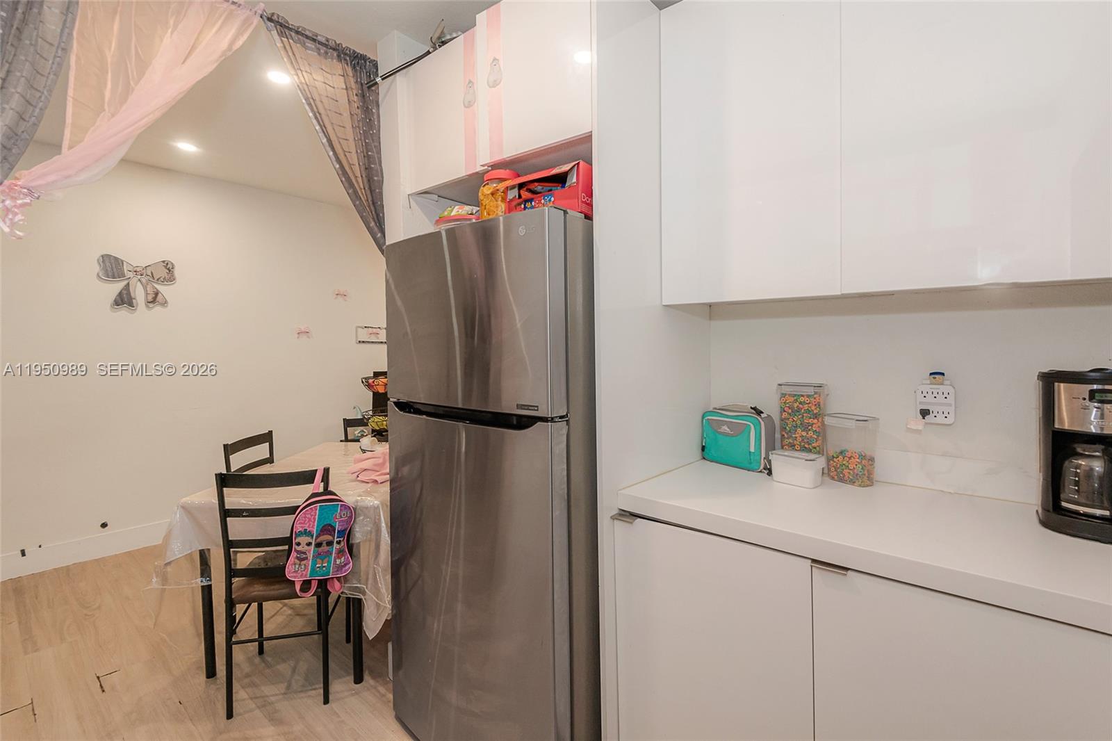 110 Northwest 58th Street Miami, FL 33127 - Photo 8 of 27 a kitchen with a refrigerator and a sink