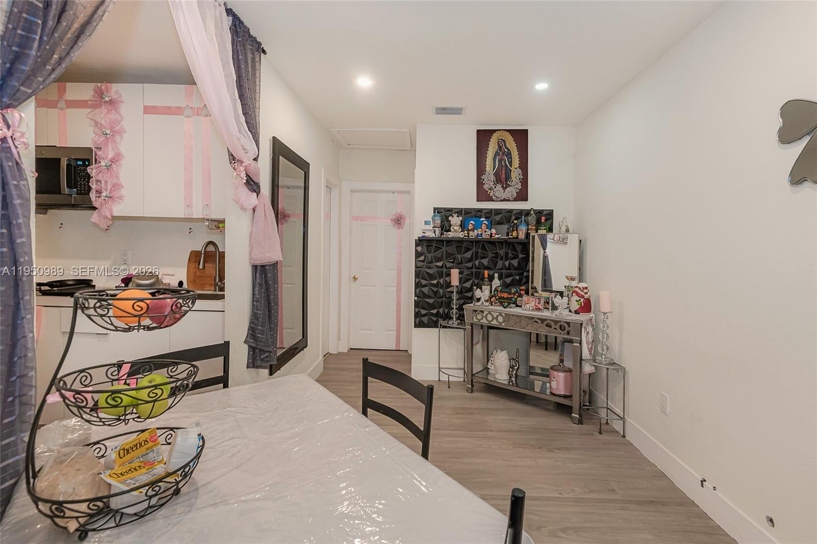 110 Northwest 58th Street Miami, FL 33127 - Photo 10 of 27 a living room with furniture and a wooden floor