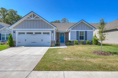 a view of a yard in front of a house