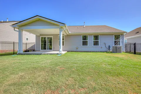 a front view of house with yard and porch