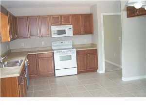 4270 Painter Branch Road Crestview, FL 32539 - Photo 3 of 24 a kitchen with a stove a sink and a microwave