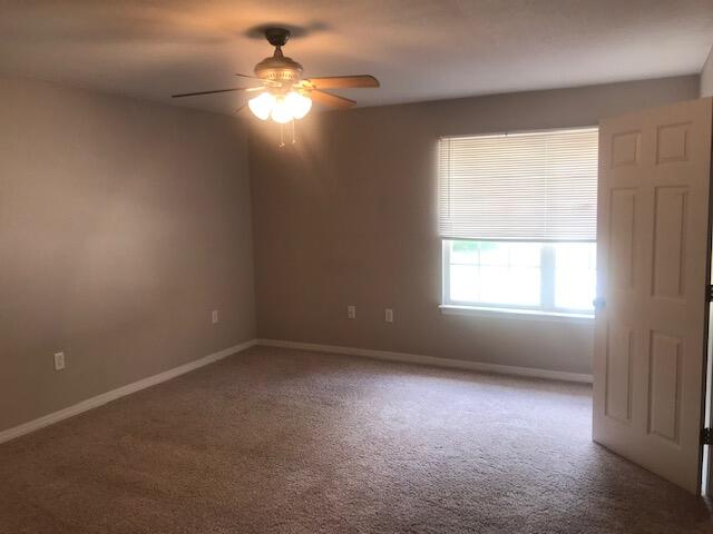 4270 Painter Branch Road Crestview, FL 32539 - Photo 7 of 24 an empty room with a window and a fan