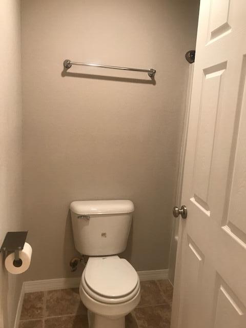 4270 Painter Branch Road Crestview, FL 32539 - Photo 10 of 24 a white toilet sitting next to a bathroom sink