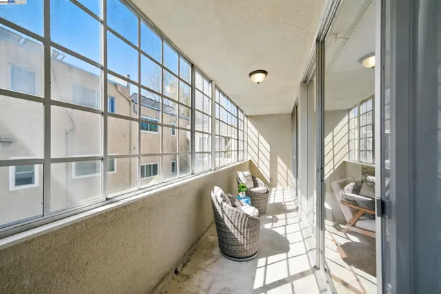 a view of an chairs and table in the balcony