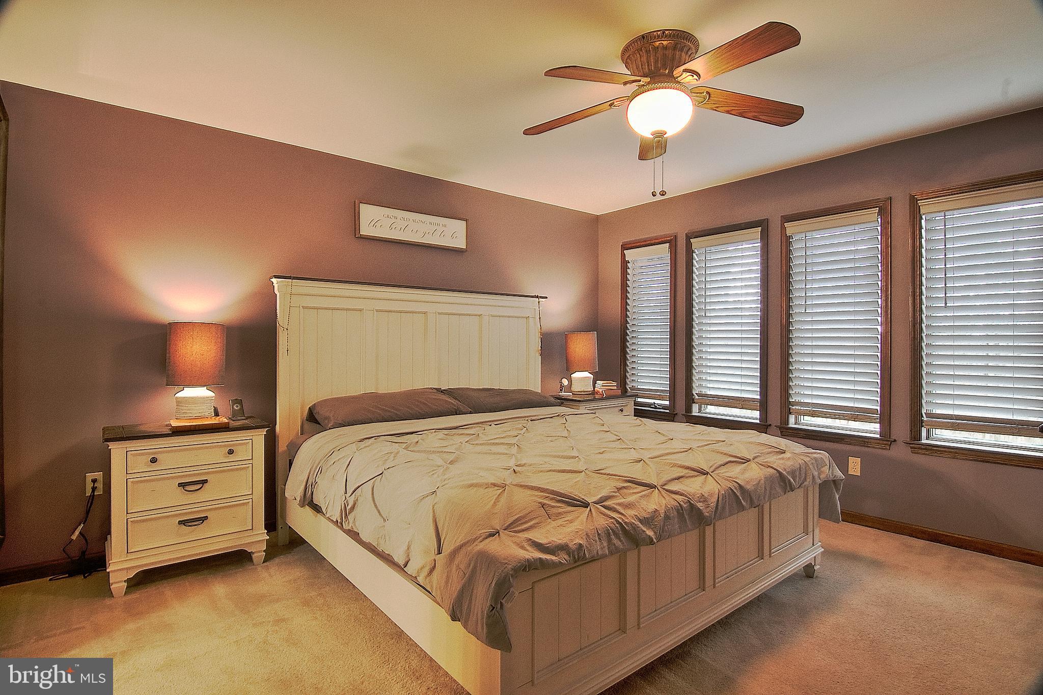 13 Shade Road Oley, PA 19547 - Photo 15 of 48 a bedroom with a bed and a chandelier