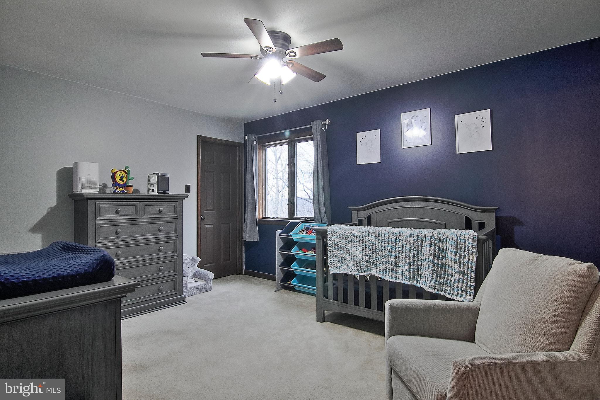 13 Shade Road Oley, PA 19547 - Photo 24 of 48 a bedroom with a bed and a couch