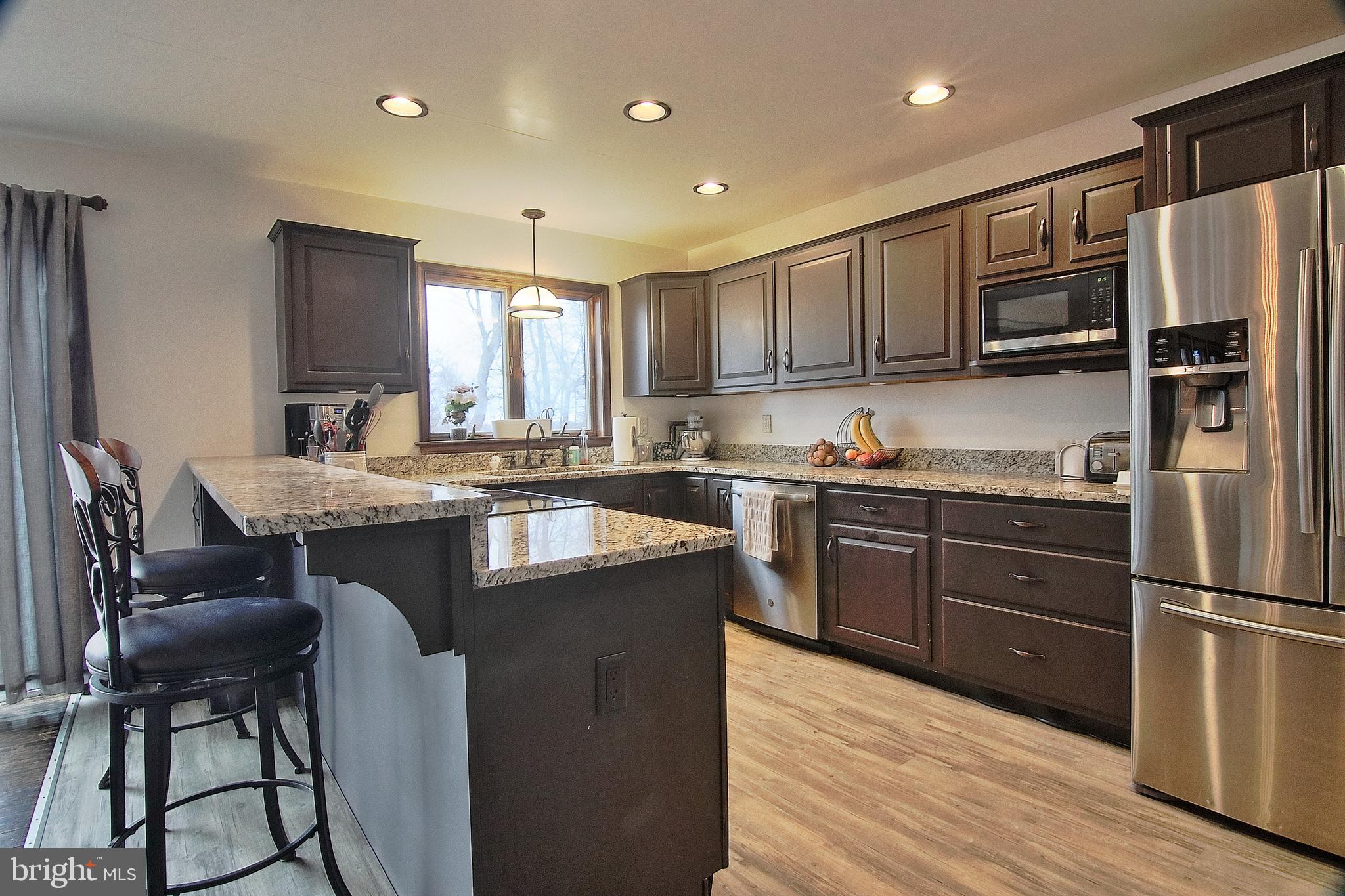 13 Shade Road Oley, PA 19547 - Photo 5 of 48 a kitchen with granite countertop a refrigerator stove top oven and sink