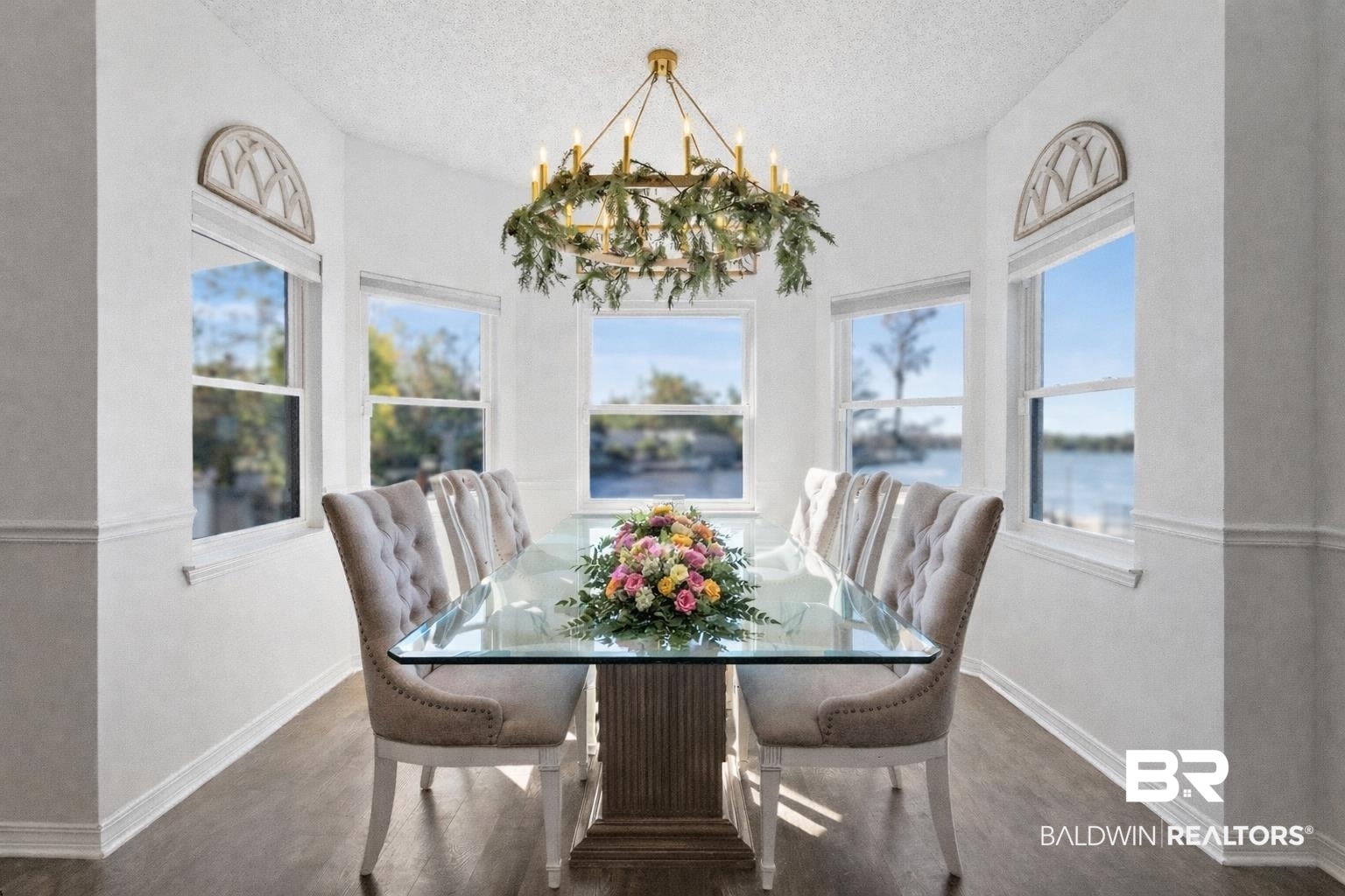41997 Bayou Road Bay Minette, AL 36507 - Photo 10 of 68 Dining space with wood finished floors, a chandelier, plenty of natural light, and a water view