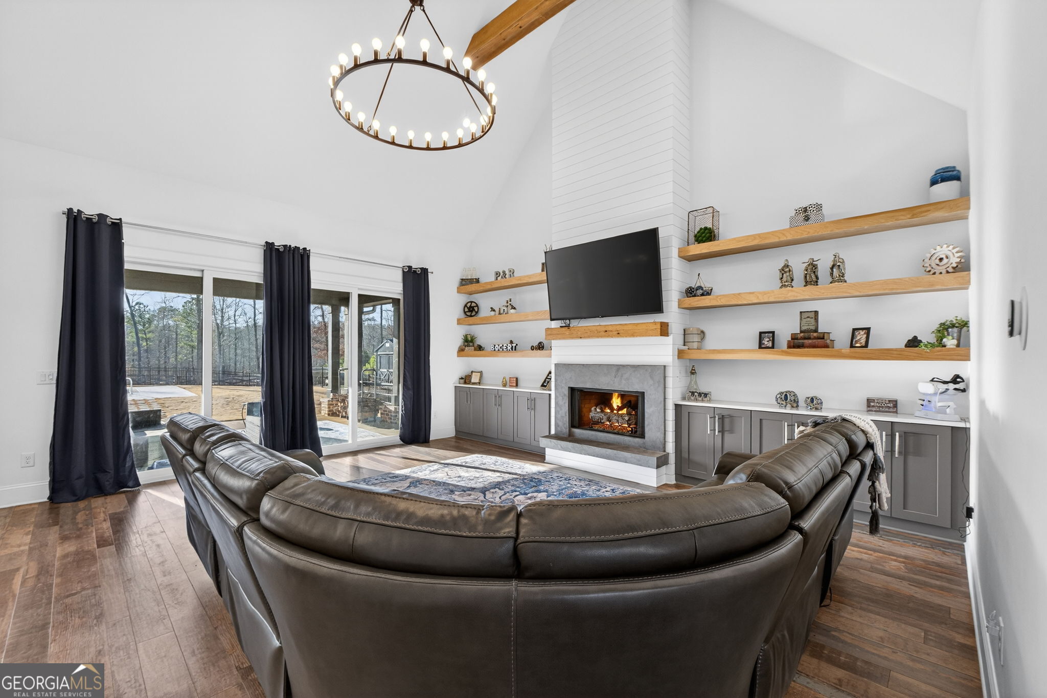 285 Dial Mill Road Oxford, GA 30054 - Photo 14 of 85 a living room with furniture a fireplace and a flat screen tv