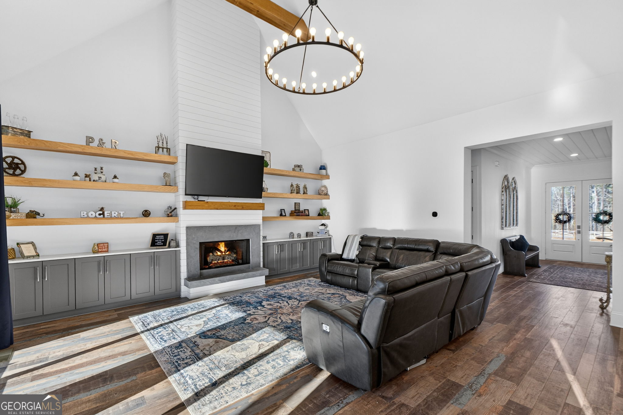 285 Dial Mill Road Oxford, GA 30054 - Photo 16 of 85 a living room with furniture a fireplace and a flat screen tv