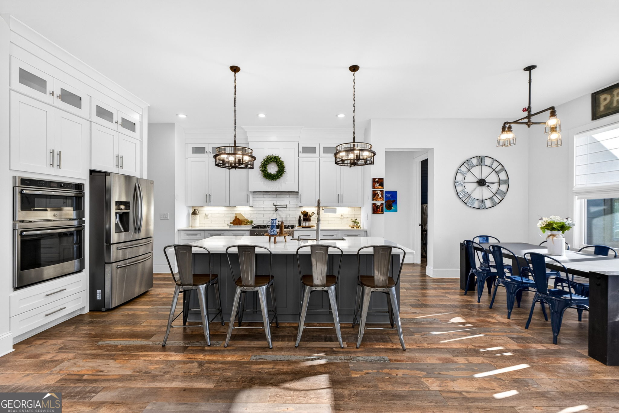 285 Dial Mill Road Oxford, GA 30054 - Photo 17 of 85 a view of a dining room and livingroom with furniture clock and a chandelier