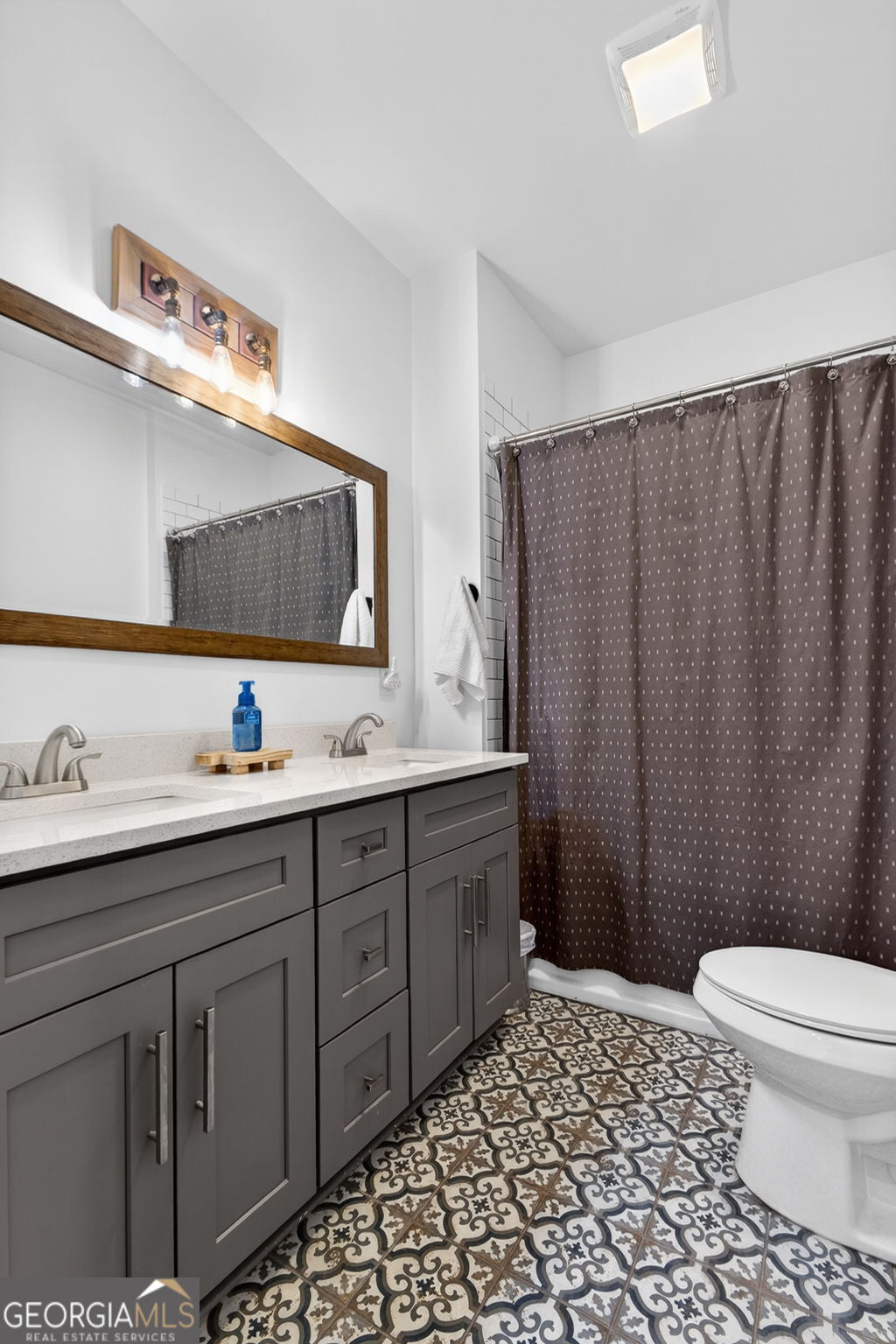 285 Dial Mill Road Oxford, GA 30054 - Photo 52 of 85 a bathroom with a sink a toilet and mirror