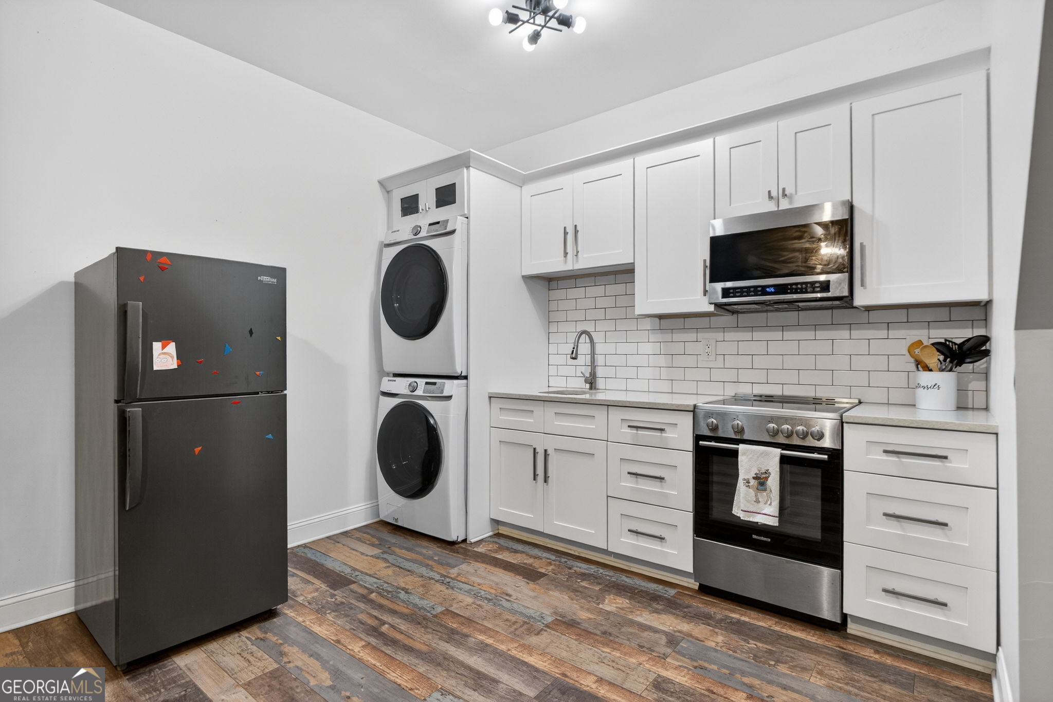 285 Dial Mill Road Oxford, GA 30054 - Photo 64 of 85 a kitchen with stainless steel appliances granite countertop a stove and a refrigerator