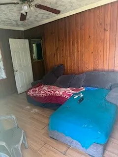 a bedroom with a bed and a mirror