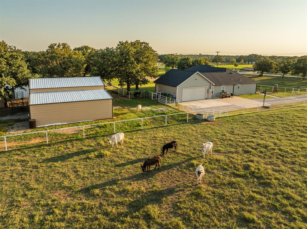 175 Porter Road Bartonville, TX 76226 - Photo 4 of 40 Whether you're a hobby farmer, equestrian, or simply craving peace, this home offers the perfect blend of modern farmhouse living & rural amenities.
