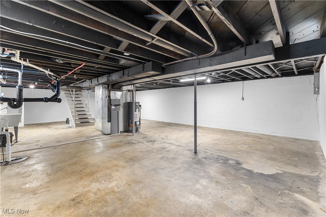 6161 Shaffer Road Northwest Warren, OH 44481 - Photo 20 of 20 Basement with sink, heating unit, and gas water heater