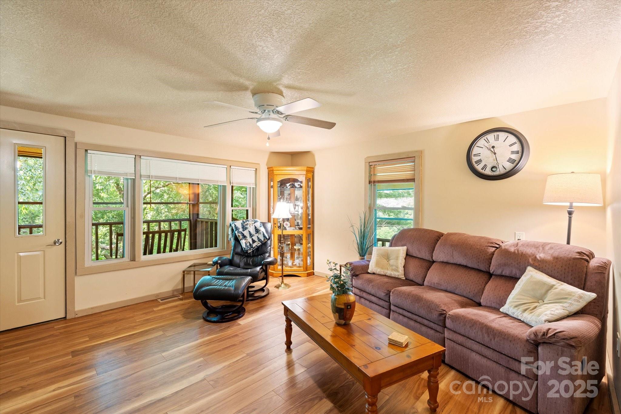 139 Ivy Ridge Church Road Mars Hill, NC 28754 - Photo 17 of 37 a living room with furniture and a large window
