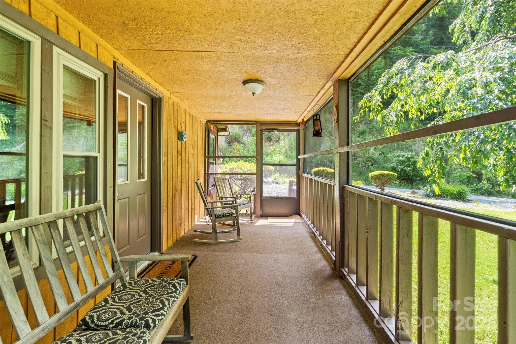 139 Ivy Ridge Church Road Mars Hill, NC 28754 - Photo 2 of 37 a view of a balcony with chair