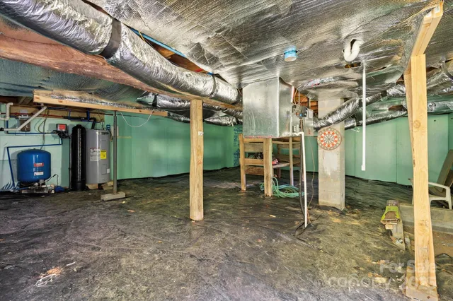 a view of a backyard with a garden and entertaining space