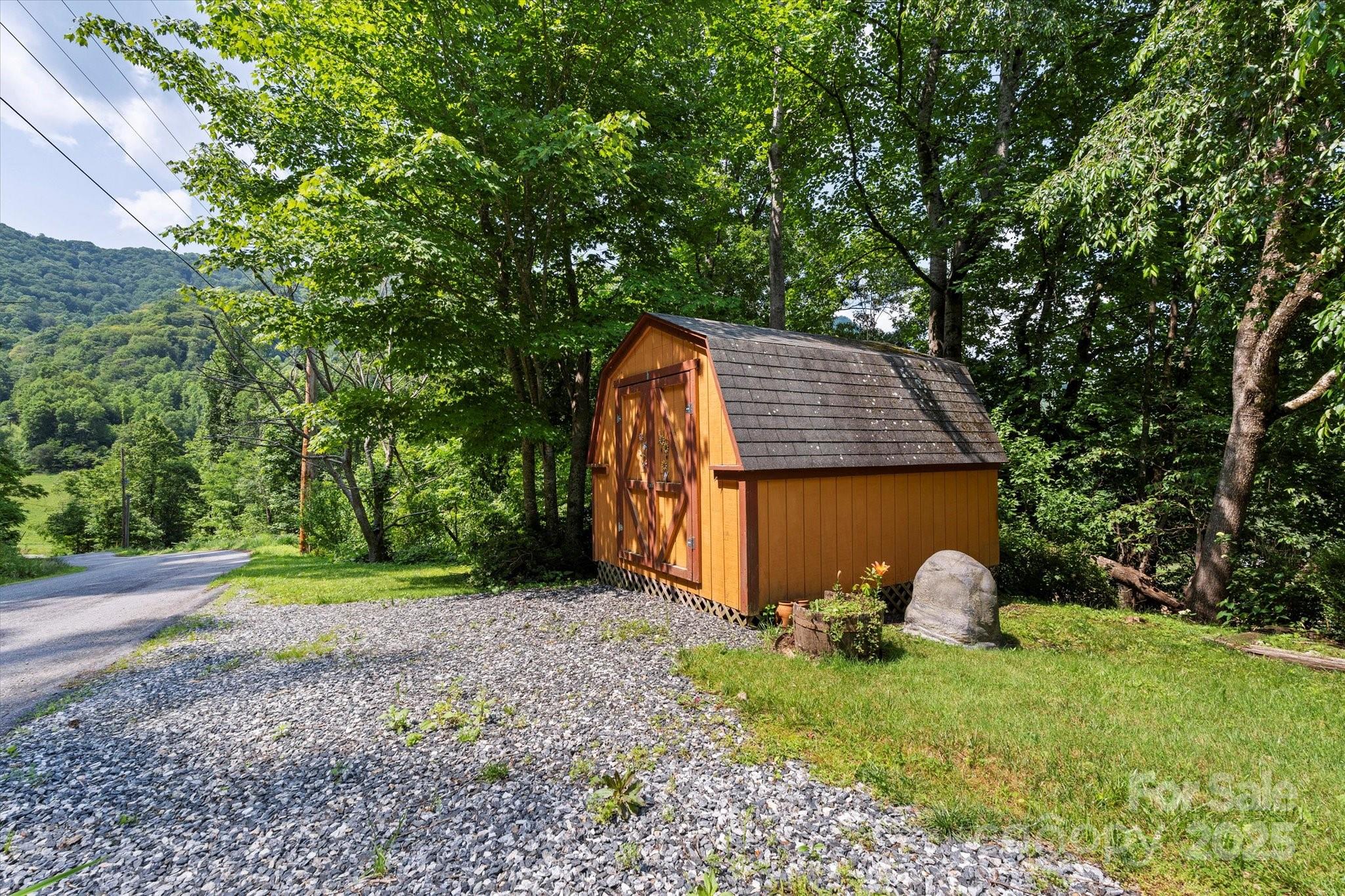 139 Ivy Ridge Church Road Mars Hill, NC 28754 - Photo 26 of 37 a view of a backyard with a garden and entertaining space
