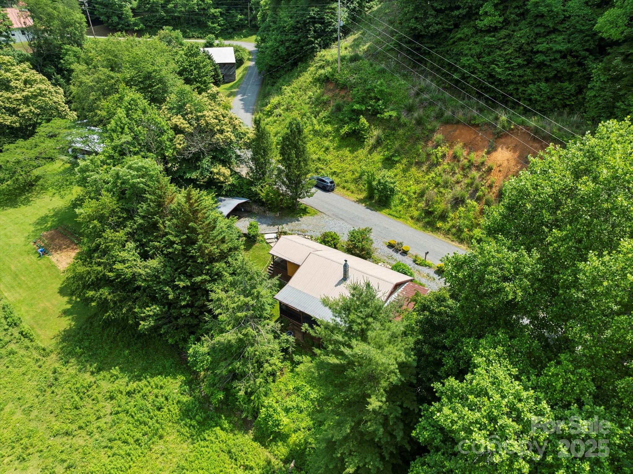 139 Ivy Ridge Church Road Mars Hill, NC 28754 - Photo 33 of 37 an aerial view of a house with a yard