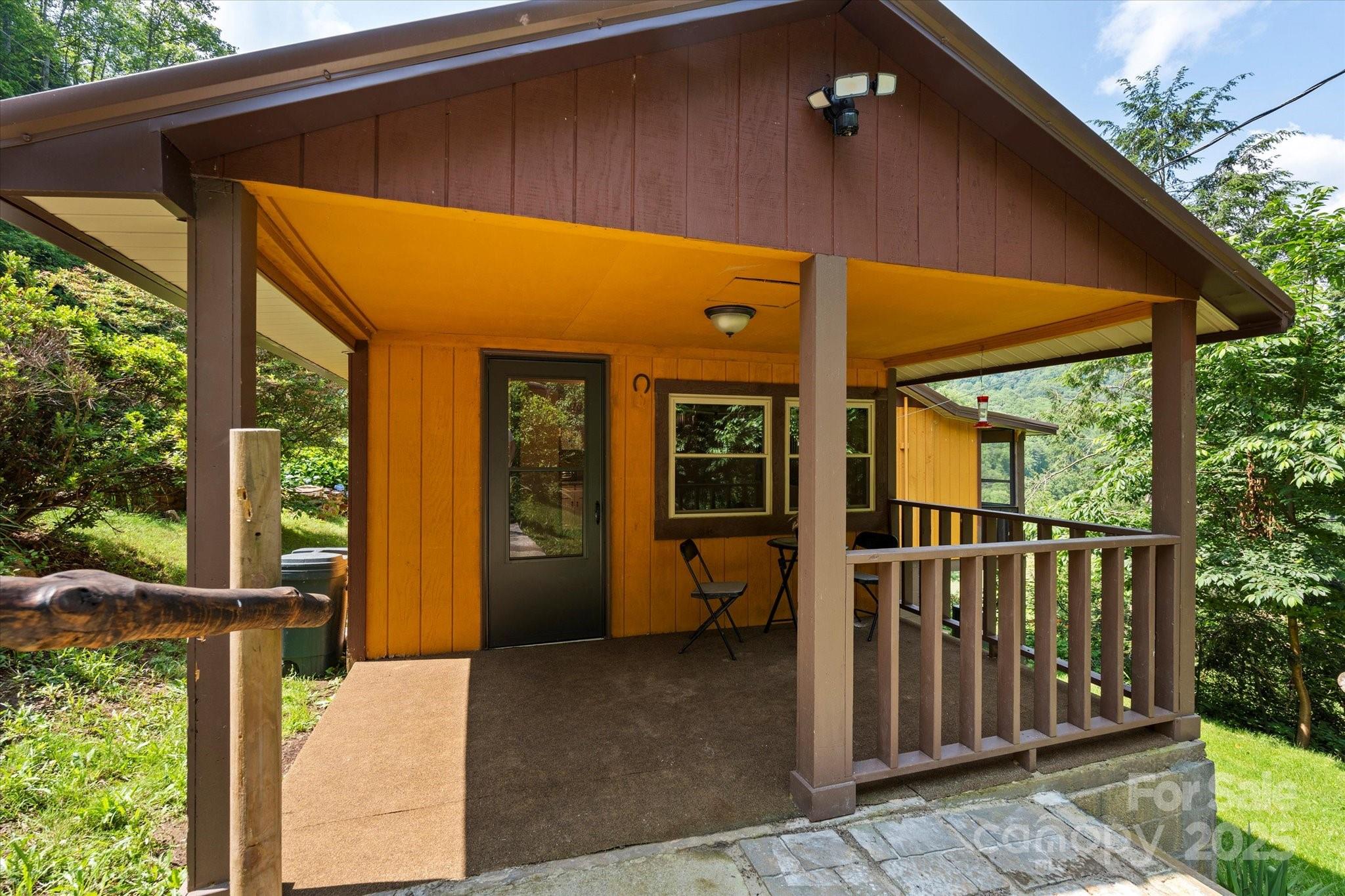 139 Ivy Ridge Church Road Mars Hill, NC 28754 - Photo 6 of 37 a view of a house with a glass door