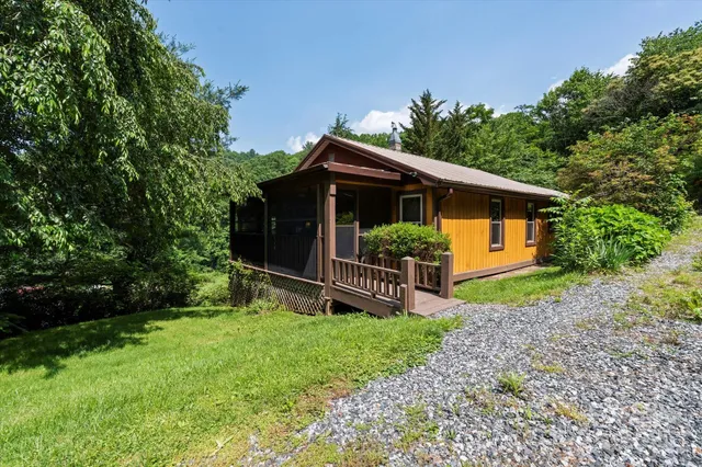 a view of a house with a yard and plants