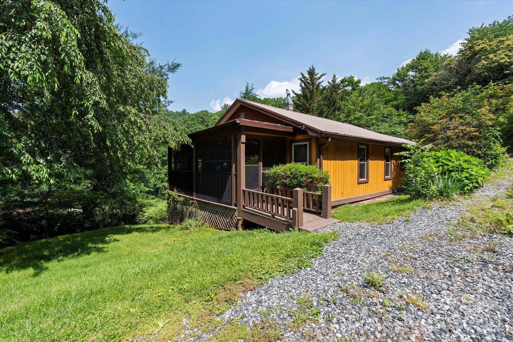 139 Ivy Ridge Church Road Mars Hill, NC 28754 - Photo 7 of 37 a view of a house with a yard and plants