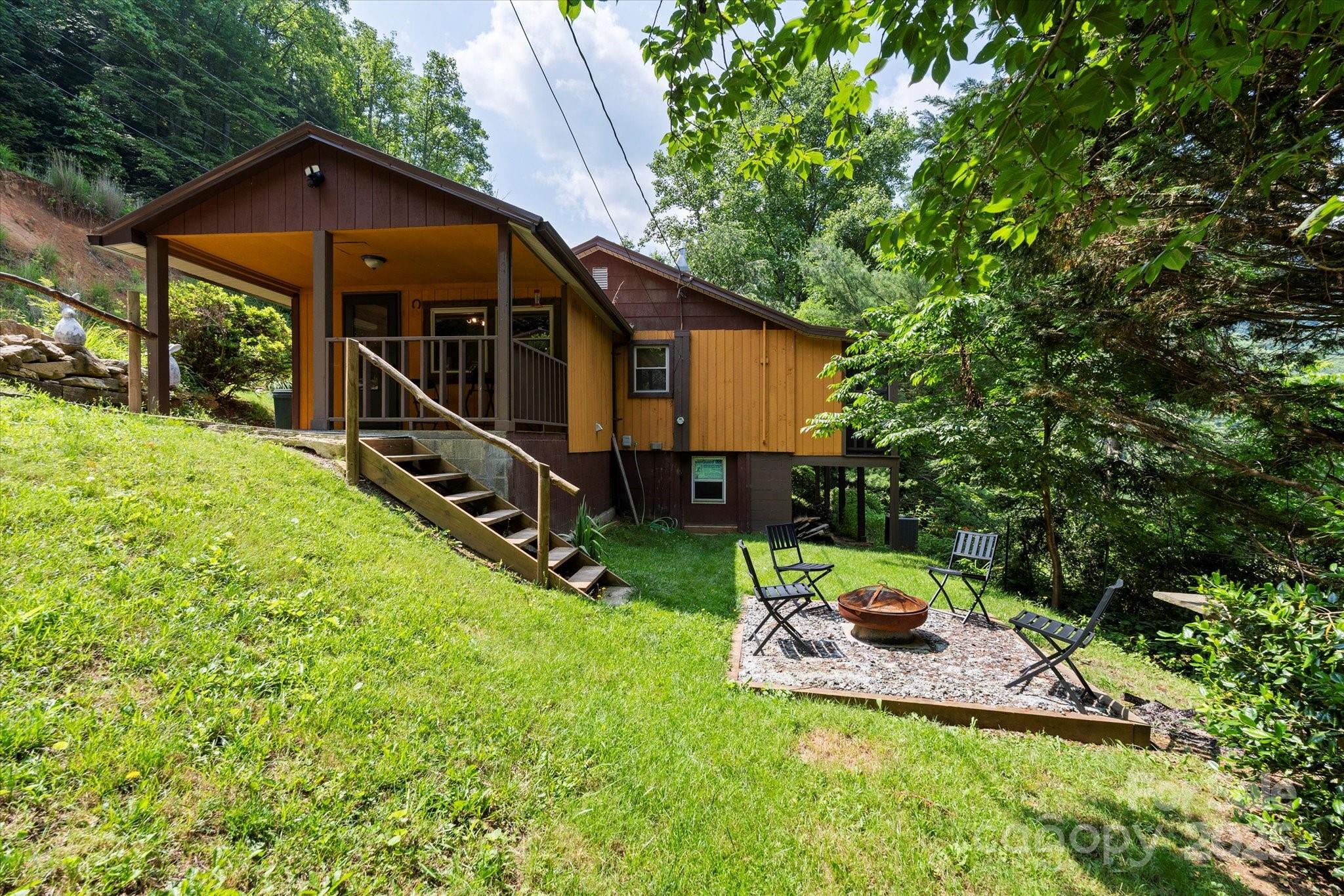 139 Ivy Ridge Church Road Mars Hill, NC 28754 - Photo 7 of 37 a view of a tiny house with backyard