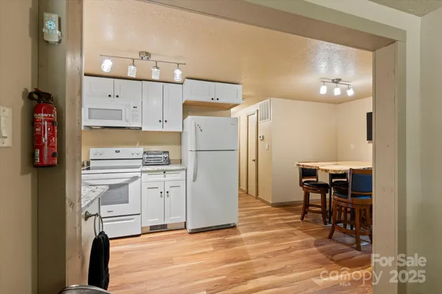a view of a livingroom with furniture and a flat screen tv