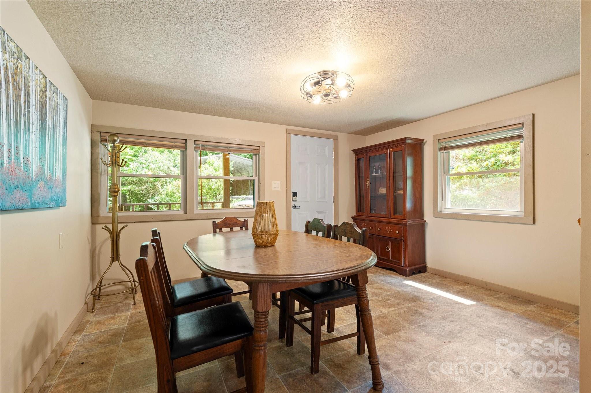 139 Ivy Ridge Church Road Mars Hill, NC 28754 - Photo 9 of 37 a view of a dining room with furniture window and outside view