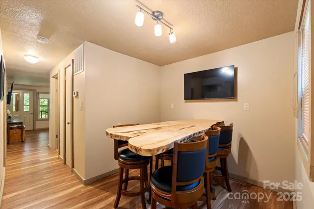a view of a dining room with furniture window and outside view