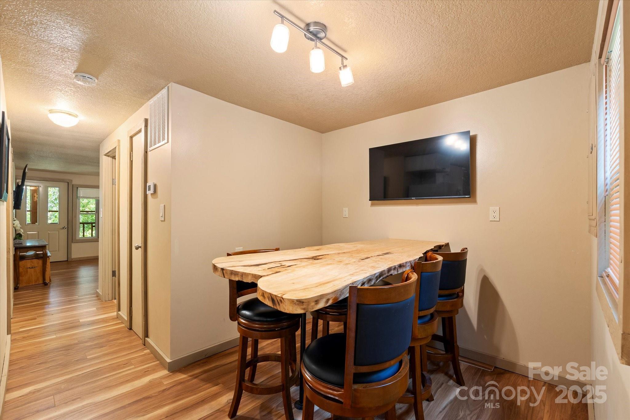 139 Ivy Ridge Church Road Mars Hill, NC 28754 - Photo 10 of 37 a view of a livingroom with furniture and a flat screen tv