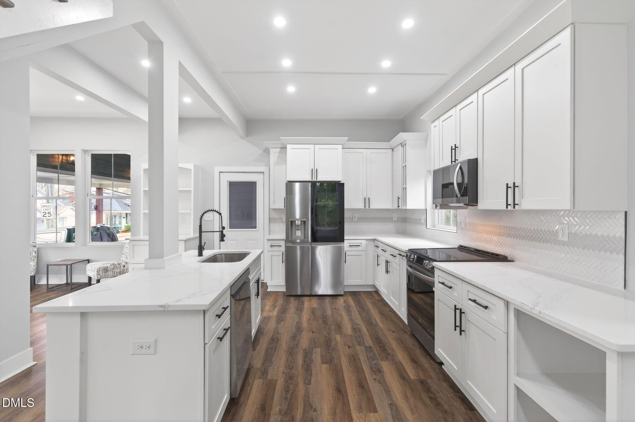 221 East Lee Street Raleigh, NC 27601 - Photo 16 of 41 a kitchen with white cabinets appliances and sink