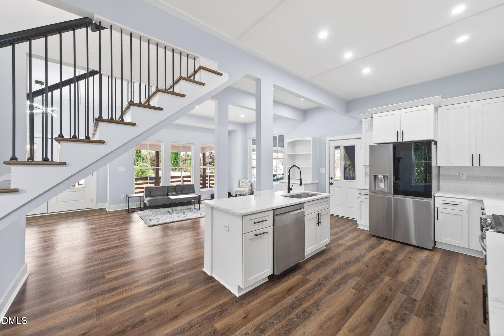 221 East Lee Street Raleigh, NC 27601 - Photo 17 of 41 a kitchen with white cabinets and white appliances