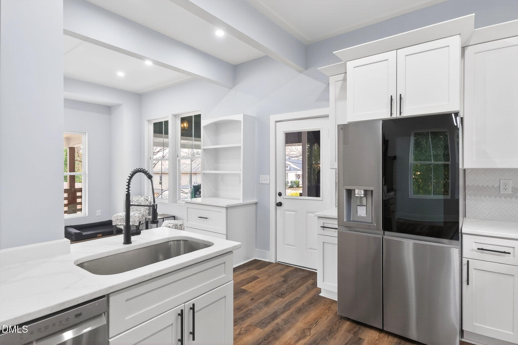 221 East Lee Street Raleigh, NC 27601 - Photo 19 of 41 a kitchen with a sink and refrigerator