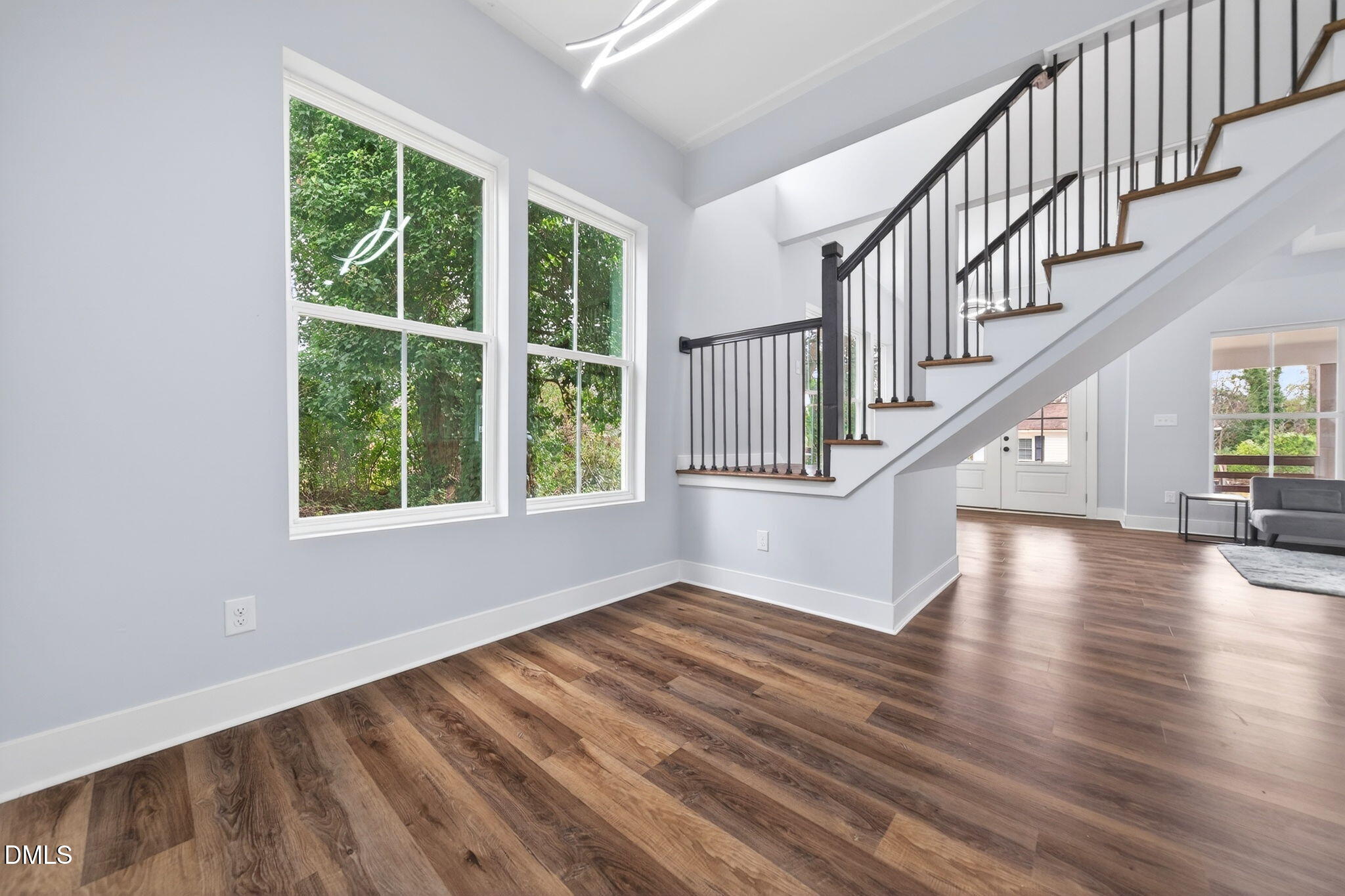 221 East Lee Street Raleigh, NC 27601 - Photo 20 of 41 a view of an entryway with wooden floor and windows