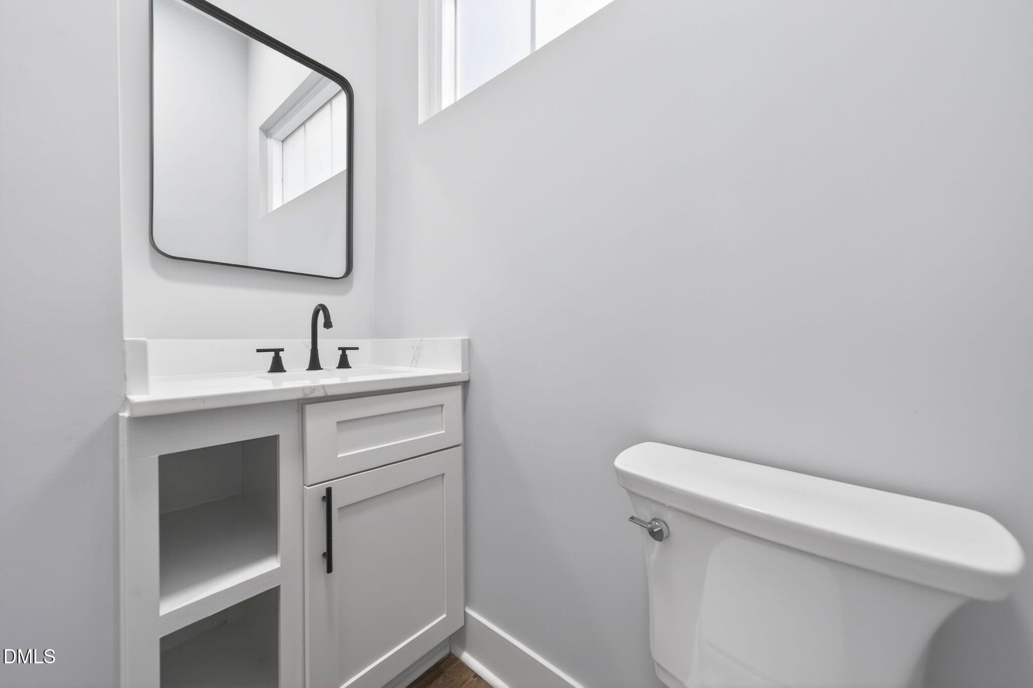 221 East Lee Street Raleigh, NC 27601 - Photo 25 of 41 a bathroom with a toilet sink and mirror