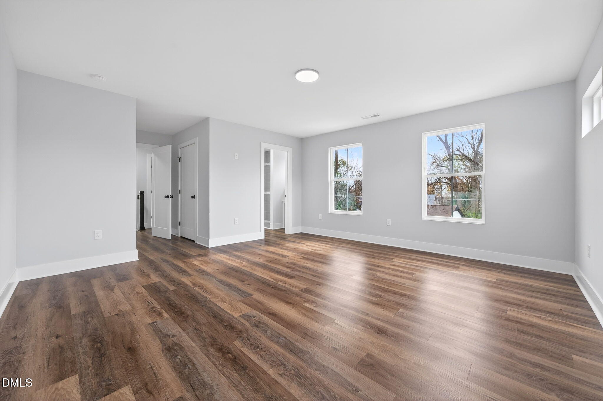 221 East Lee Street Raleigh, NC 27601 - Photo 29 of 41 an empty room with wooden floor and windows