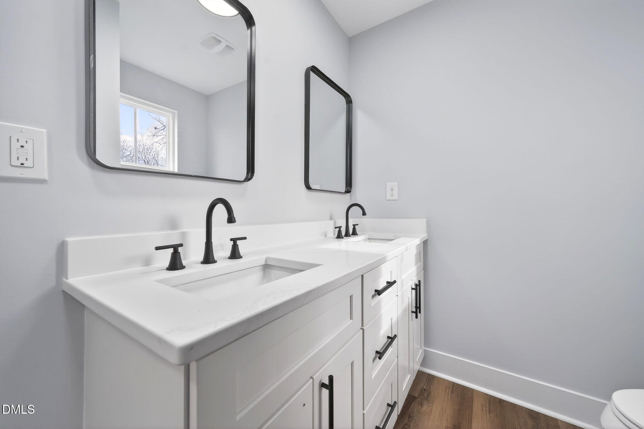 221 East Lee Street Raleigh, NC 27601 - Photo 32 of 41 a bathroom with 2 sink and a mirror