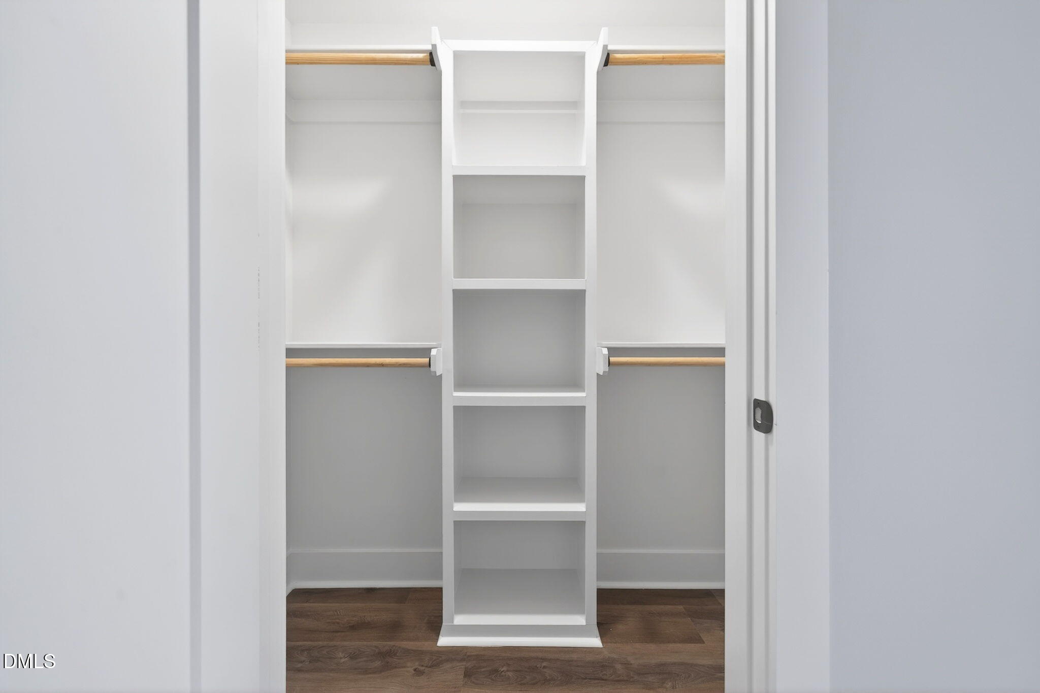 221 East Lee Street Raleigh, NC 27601 - Photo 33 of 41 a view of an empty walk in closet with empty racks