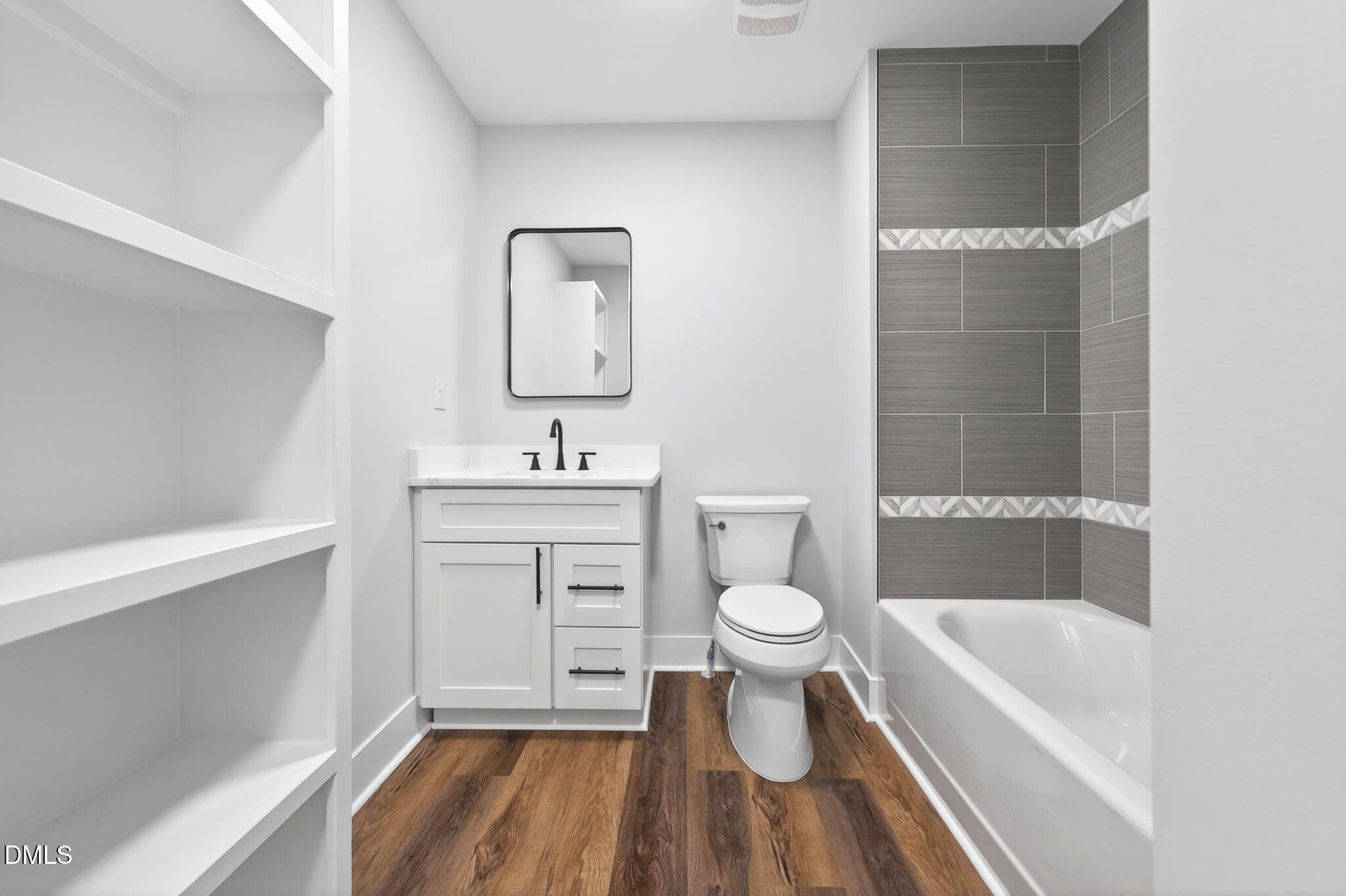 221 East Lee Street Raleigh, NC 27601 - Photo 35 of 41 a bathroom with a sink toilet a bathtub and shower