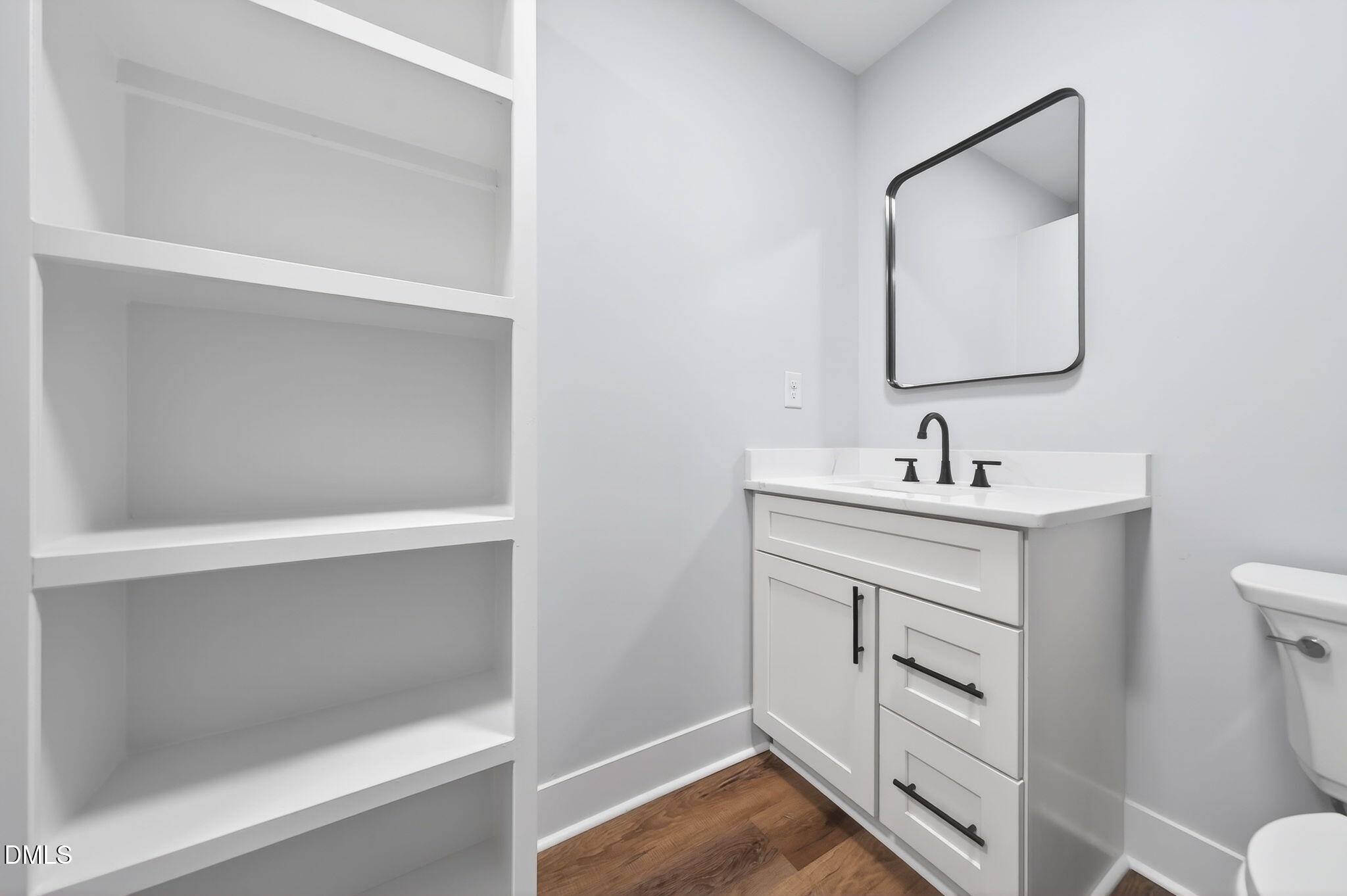 221 East Lee Street Raleigh, NC 27601 - Photo 37 of 41 a bathroom with a sink toilet and mirror