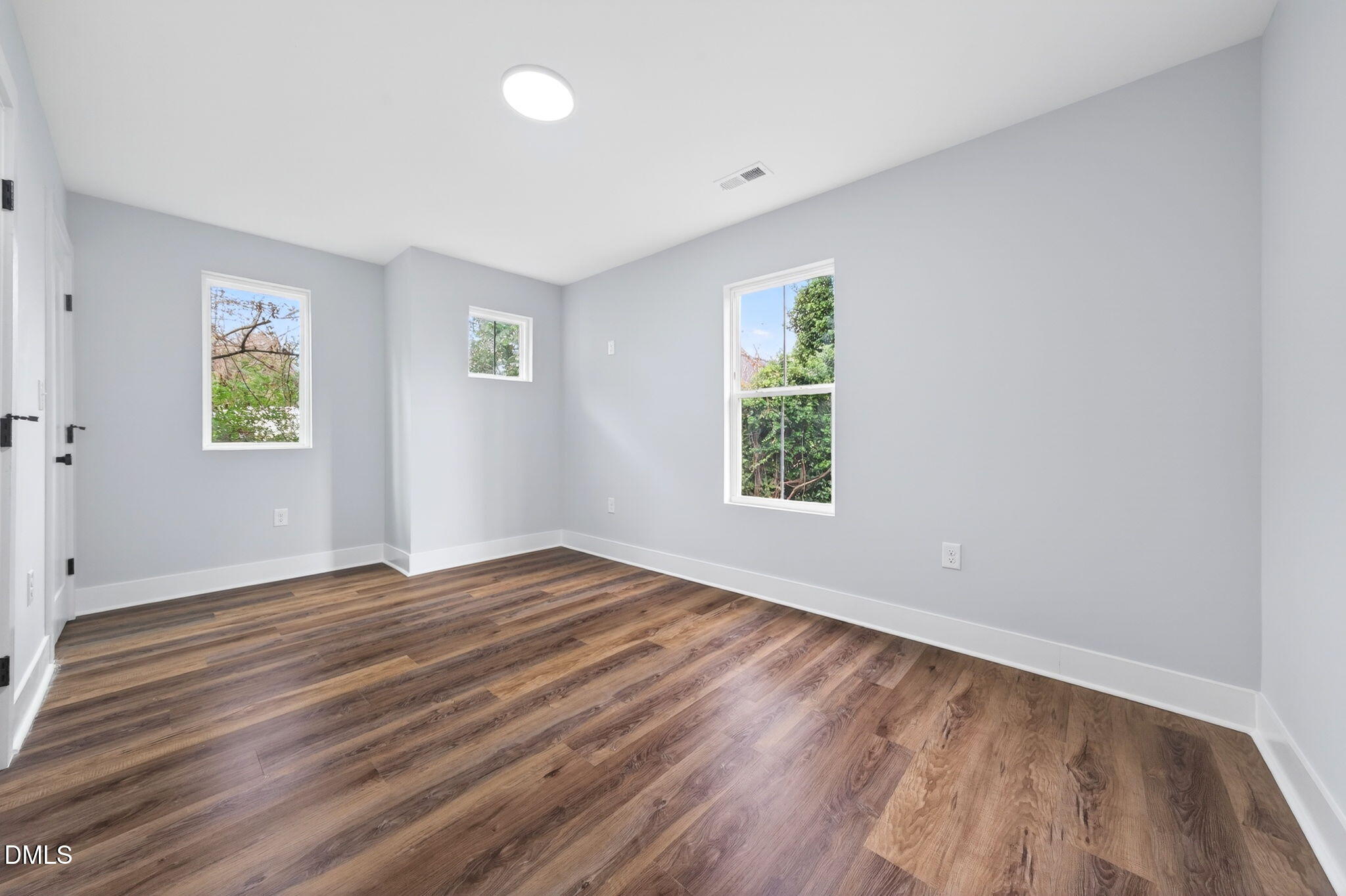 221 East Lee Street Raleigh, NC 27601 - Photo 39 of 41 wooden floor in an empty room with a window
