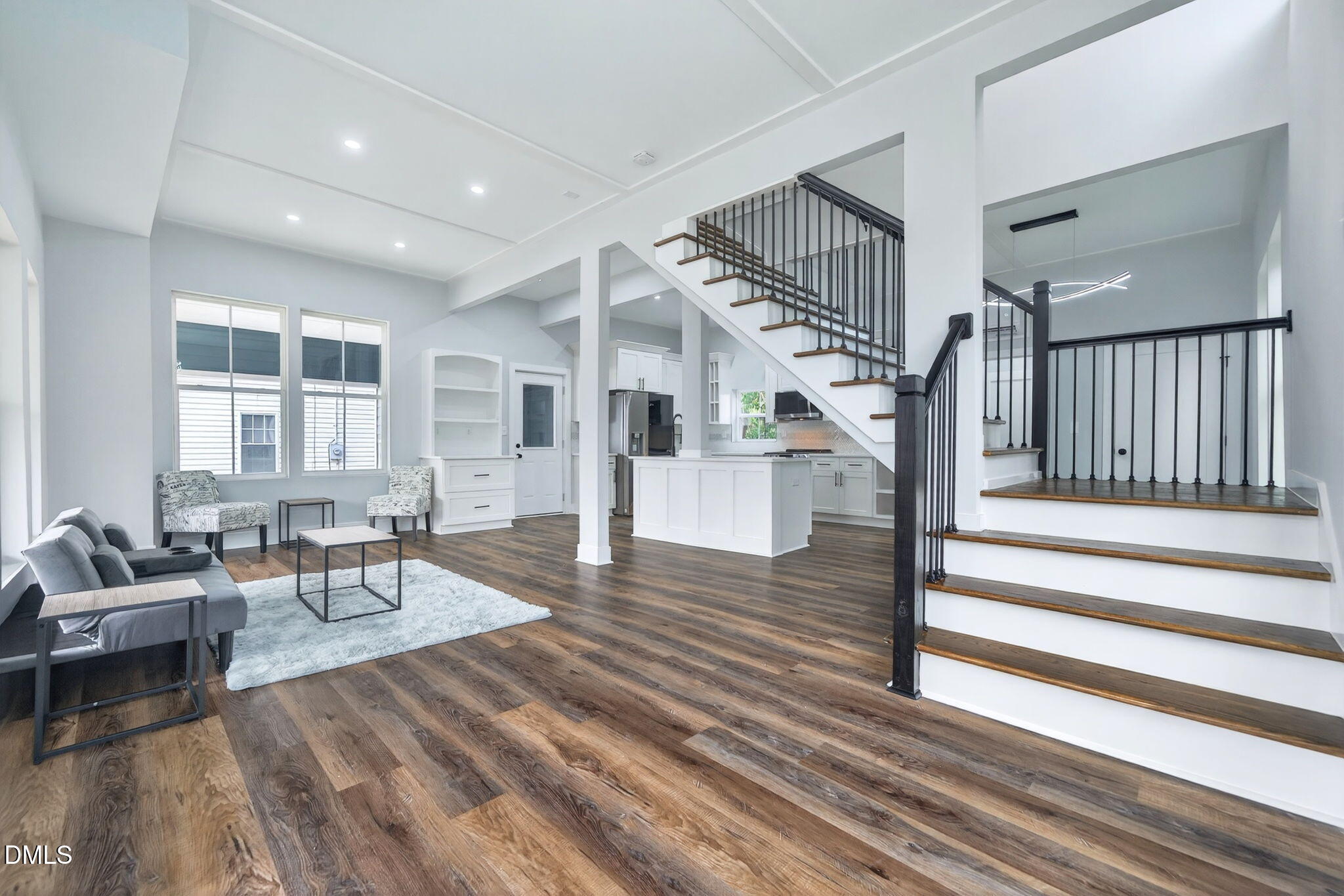 221 East Lee Street Raleigh, NC 27601 - Photo 5 of 41 a living room with wooden floor furniture and a fireplace