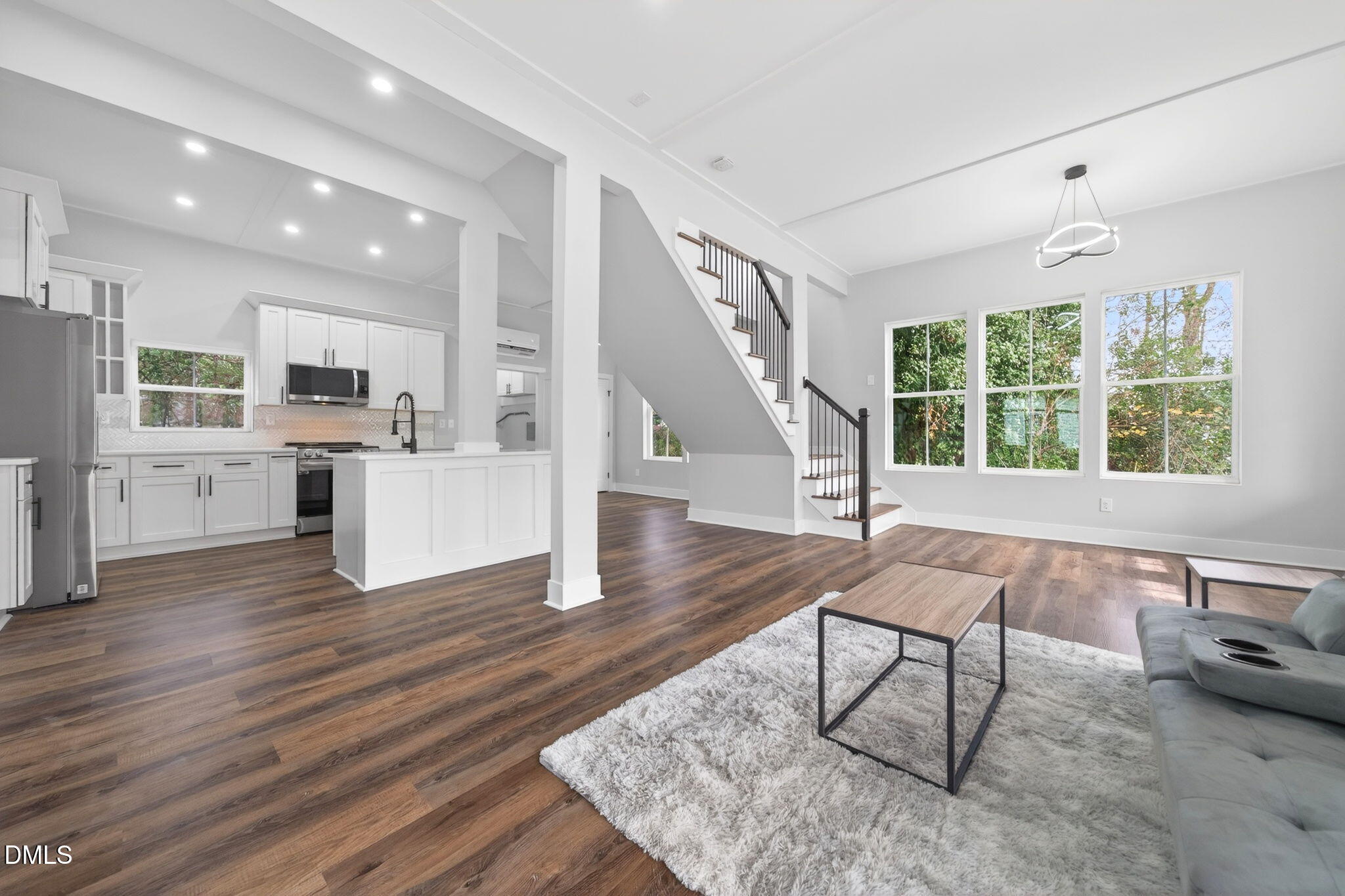 221 East Lee Street Raleigh, NC 27601 - Photo 9 of 41 a living room with furniture and a wooden floor